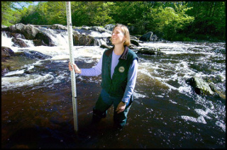 Melissa Laser working in a salmon stream in Maine